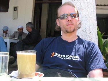 World Nomads helping me to relax and enjoy a cup of coffee in Asilah, on the coast of Morocco.