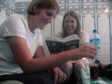 Sophie and Esther, making a cup of tea in a shot glass.